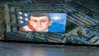 This photo illustration created on Thursday, April 13, 2023, shows National Guardsman Jack Teixeira reflected in an image of the Pentagon in Arlington, Virginia. FBI agents on Thursday arrested Teixeira on charges he was behind a major leak of sensitive U.S. government secrets, including about the Ukraine-Russia war.