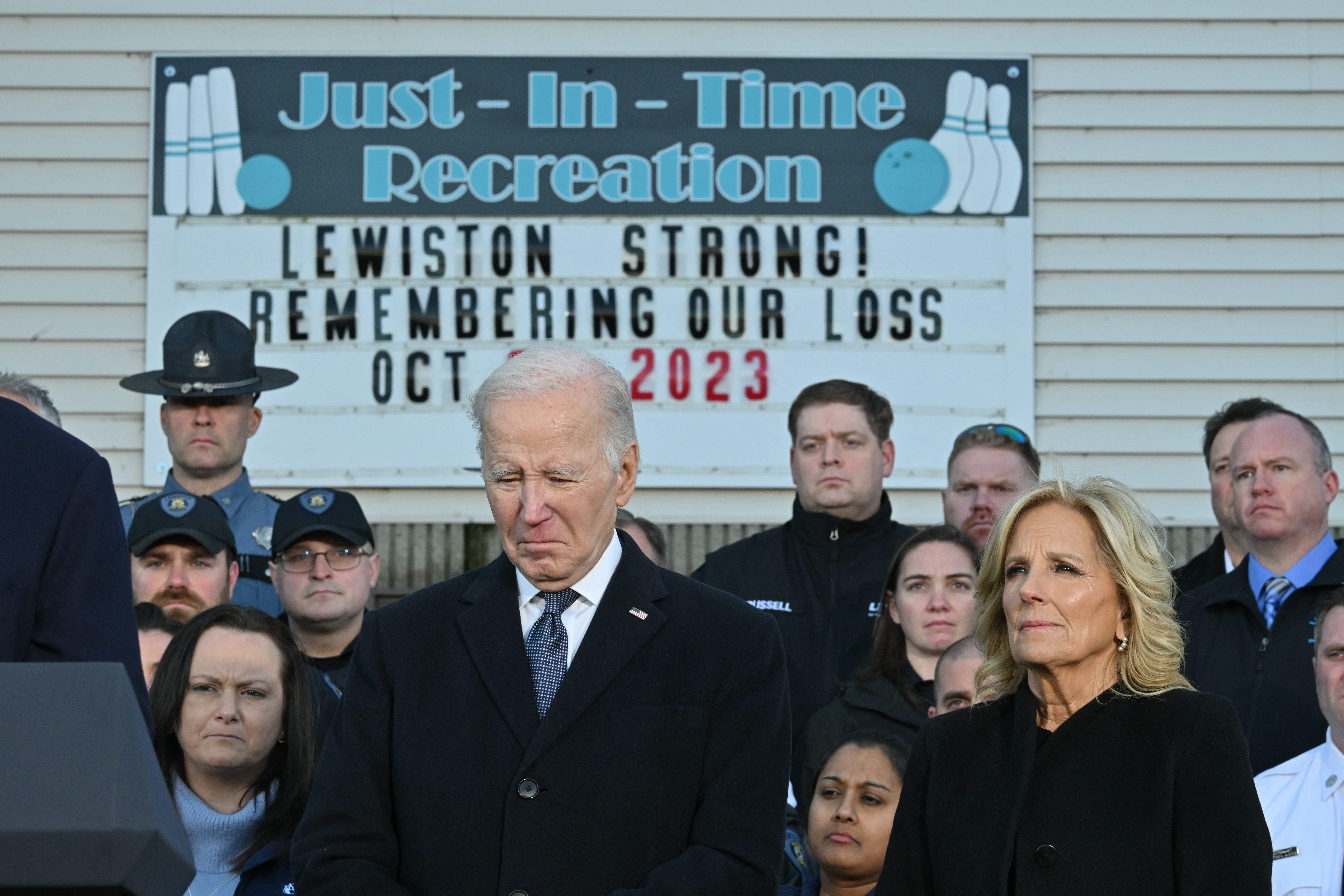 President Joe Biden and first lady Jill Biden surrounded by first responders, nurses and others on the front lines of the response to the Oct. 25 mass shooting in Lewiston, Maine, during a visit on Friday, Nov. 3, 2023.