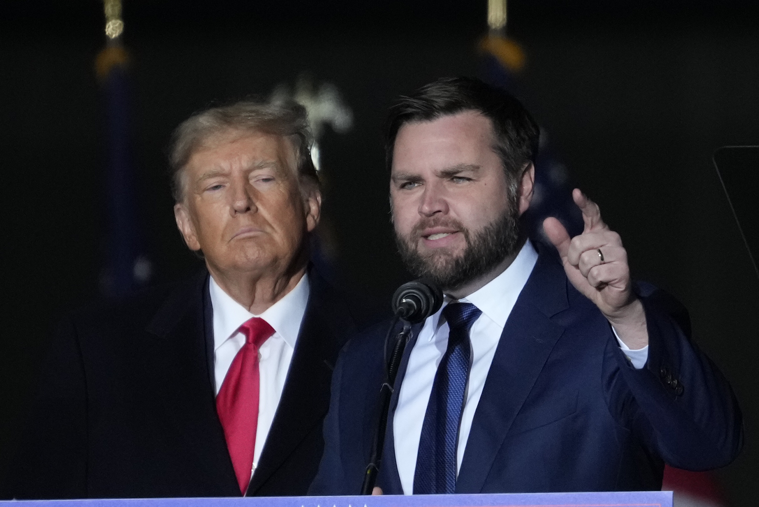 Former U.S. President Donald Trump and Republican candidate for U.S. Senate JD Vance greet supporters during the rally at the Dayton International Airport on November 7, 2022 in Vandalia, Ohio. 