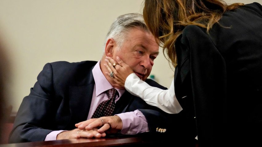 Actor Alec Baldwin interacts with his wife Hilaria Baldwin during his hearing in Santa Fe County District Court, July 10, 2024, in Santa Fe, New Mexico. In October 2021, on the New Mexico set of the Western movie “Rust,” a gun pointed by Baldwin discharged a live round, killing the film’s cinematographer Halyna Hutchins and wounding its director. (Photo by Ross D. Franklin / POOL / AFP) (Photo by ROSS D. FRANKLIN/POOL/AFP via Getty Images)