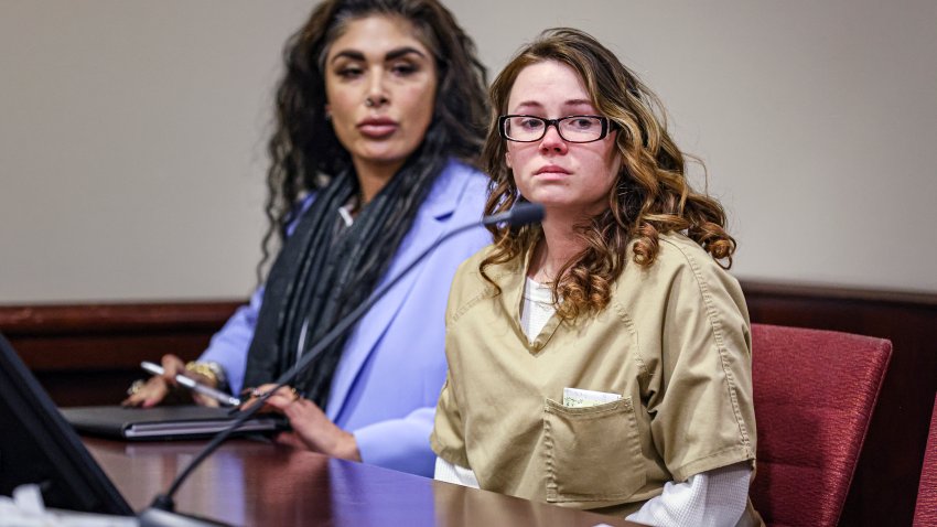 Hannah Gutierrez-Reed, the weapons supervisor on the set of the Western film “Rust,” right, sits beside paralegal Carmella Sisneros at the start of her plea hearing at the First Judicial District Courthouse in Santa Fe, N.M., Monday, Oct. 7, 2024. (Gabriela Campos/Santa Fe New Mexican via AP, Pool)