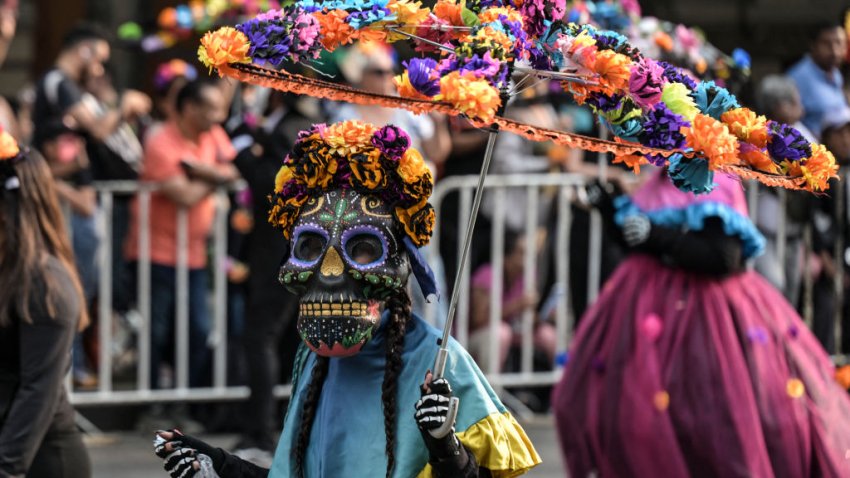 People in costume take part in the Grand Parade to commemorate the Day of the Dead in Mexico City on November 2, 2024. (Photo by Yuri CORTEZ / AFP) (Photo by YURI CORTEZ/AFP via Getty Images)