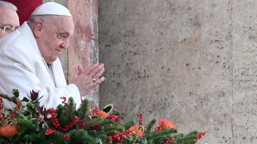 Pope Francis greets the crowd from the main balcony of St. Peter’s basilica after the Urbi et Orbi message and blessing to the city and the world as part of Christmas celebrations, at St Peter’s square in the Vatican on December 25, 2024. (Photo by Tiziana FABI / AFP) (Photo by TIZIANA FABI/AFP via Getty Images)