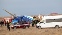 AKTAU, KAZAKHSTAN – DECEMBER 25: A view of the scene after an Azerbaijan Airlines flight with 67 people on board, traveling from the Azerbaijani capital Baku to Grozny in Russia’s Chechnya region, crashed near the Kazakh Caspian city of Aktau on December 25, 2024. According to the ministry, 62 passengers and five crew members were on board Flight 8432, which caught fire following the crash, adding that emergency responders are working to extinguish it. (Photo by Issa Tazhenbayev/Anadolu via Getty Images)