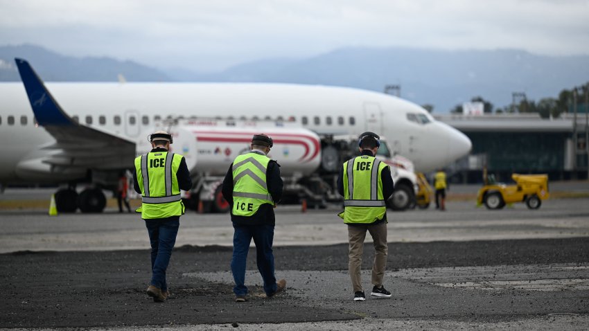 US Immigration and Customs Enforcement (ICE) agents prepare for the arrival of Guatemalan migrants deported from the United States at the Air Force Base in Guatemala City on January 27, 2023. – In 2022, US immigration authorities deported 40,713 Guatemalans by air for illegally entering its territory, while in 2021, the figure was 17,806, according to reports from the Guatemalan State Migration Institute. (Photo by Johan ORDONEZ / AFP) (Photo by JOHAN ORDONEZ/AFP via Getty Images)