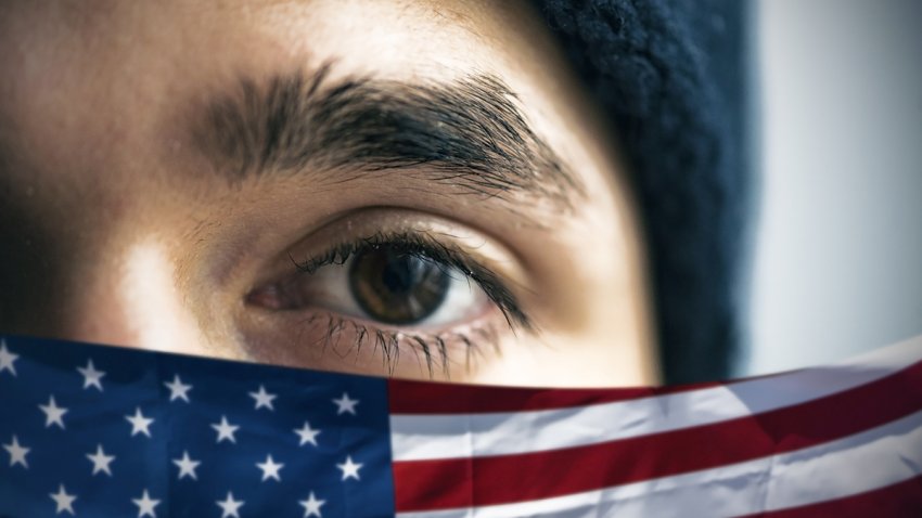 Refugee and American flag, conceptual picture