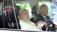Pope Francis waves as he leaves the Gemelli hospital after a five weeks hospitalization for pneumonia, in Rome on March 23, 2025. Pope Francis is to leave hospital todayand return to his residence in the Vatican, where he is to spend “at least two months” recovering, one of his doctors announced during a press conference on March 22, 2025. (Photo by Tiziana FABI / AFP) (Photo by TIZIANA FABI/AFP via Getty Images)