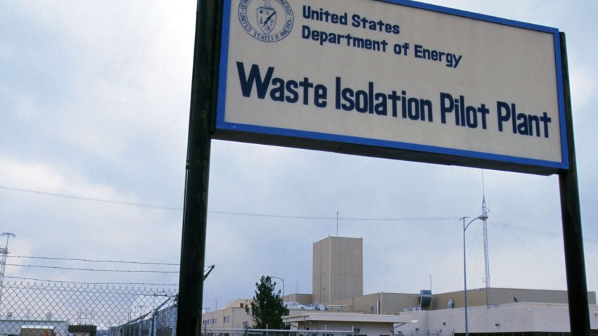 PHOTO FEATURE: NEW MEXICO NUCLEAR WASTE: (NINE OF FOURTEEN ): WIPP, the controversial nuclear waste dump site in New Mexico will open, pending approval from the state of New Mexico. In the background is the main building of the Waste Isolation Pilot Plant, a U.S. Department of Energy facility designed to demonstrate the safe disposal of transuranic waste left from the production of nuclear weapons in deep geologic salt beds. WIPP is managed by the U.S. Department of Energy’s Carlsbad Area Office, located in southeastern New Mexico near Carlsbad. Project facilities include excavated rooms 2,150 feet underground in an ancient, stable salt formation. Transuranic waste consists of clothing, tools, rags, and other such items contaminated with small amounts of radioactive elements — mostly plutonium. These elements are radioactive, man-made, and have an atomic number greater than uranium — thus transuranic (beyond uranium).(Photo by Joe Raedle)