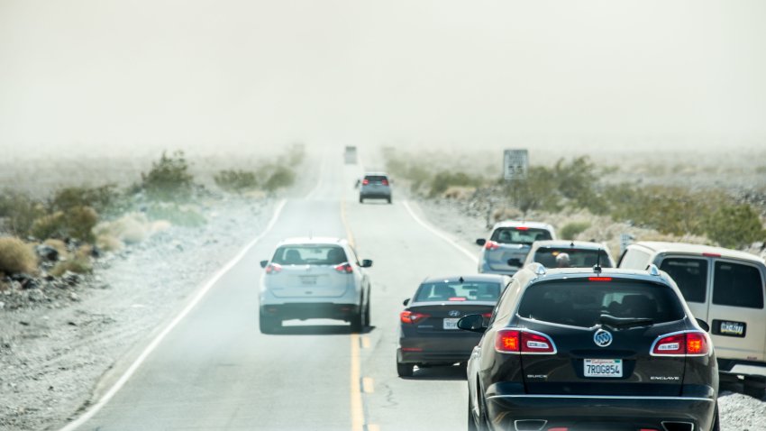 DEATH VALLEY, PANAMINT SPRINGS, CA, UNITED STATES – 2016/06/15: Cars are stopped before a dust storm with no visibility closed SR190 between Stovepipe Wells and Panamint Springs in Death Valley on June 15, 2016, in CA, United States. Dangerous, potentially record-breaking heat will scorch portions of California with temperatures climbing well past 100 degrees F in parts of California, Nevada, Utah, Colorado, Kansas, Texas, Oklahoma, New Mexico and Arizona. (Photo by Hugh Peterswald/Pacific Press/LightRocket via Getty Images)