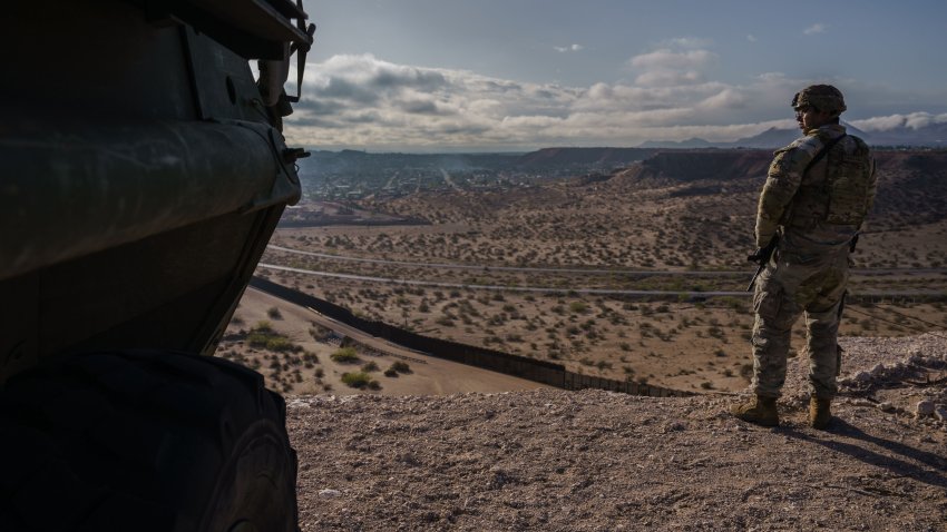 A U.S. Army soldier stands next to a Stryker armored infantry transport vehicle, which has been deployed along the U.S.-Mexico border as part of the military’s Joint Task Force Southern Border mission, in Sunland Park, New Mexico on Friday, April 4, 2025.